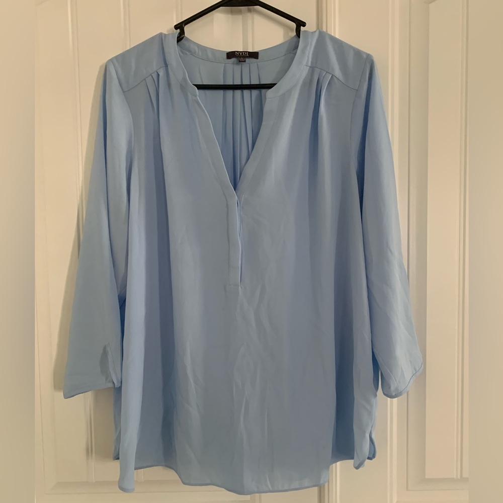 Light blue blouse.